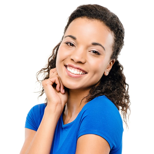 A young woman smiling after her laser dental treatment
